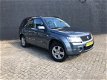 Suzuki Grand Vitara - 2.0-16V Exclusive // 4 NIEUWE BANDEN// AIRCO // - 1 - Thumbnail