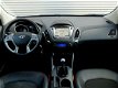 Hyundai ix35 - 1.6i GDI Go *Navigatie*Parkeersens.*Trekhaak*Stoelverw - 1 - Thumbnail