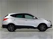 Hyundai ix35 - 1.6i GDI Go *Navigatie*Parkeersens.*Trekhaak*Stoelverw - 1 - Thumbnail