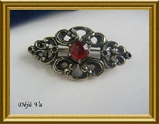 Mooie oude zilveren (835) broche met rode steen