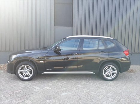 BMW X1 - 1.8i sDrive 150pk RIJKLAAR airconditioning, parkeersensoren voor+achter, navigatie, 5-ster - 1