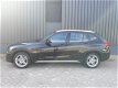 BMW X1 - 1.8i sDrive 150pk RIJKLAAR airconditioning, parkeersensoren voor+achter, navigatie, 5-ster - 1 - Thumbnail