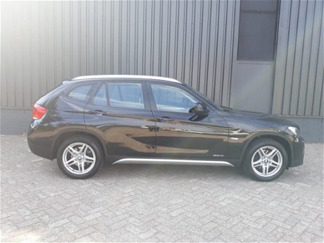 BMW X1 - 1.8i sDrive 150pk RIJKLAAR airconditioning, parkeersensoren voor+achter, navigatie, 5-ster - 1