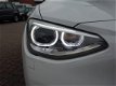 BMW 1-serie - 116i AUT8 136pk 5drs Xen/Led Navi/Tel Clima Cruise Business+ 5-Deurs - 1 - Thumbnail