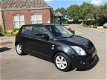 Suzuki Swift - 1.3 Exclusive 5 DEURS LEER/ AIRCO - 1 - Thumbnail