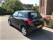 Suzuki Swift - 1.3 Exclusive 5 DEURS LEER/ AIRCO - 1 - Thumbnail