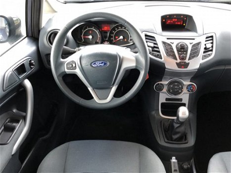 Ford Fiesta - 1.25 Champion | Lichtmetalen velgen | Airco | Elektrische Ramen | | Radio CD Speler | - 1