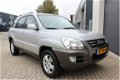 Kia Sportage - 2.0 CRDi Adventure 4WD, Automaat, Half Leer, LMV, Clima - 1 - Thumbnail