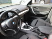 BMW 1-serie - 118i Business Line Style Clima/PDC/sportzetels/cruise/LMsp.vlgn - 1 - Thumbnail