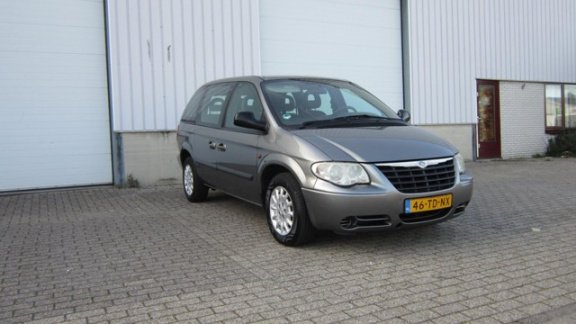 Chrysler Voyager - 2.4i SE Luxe 7persoons - 1