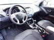 Hyundai ix35 - 1.6i GDI Business Style+ (leer, navi, xenon, pdc) - 1 - Thumbnail