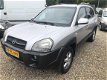 Hyundai Tucson - 2.0i Dynamic, AIRCO - 1 - Thumbnail