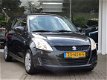 Suzuki Swift - 1.2 Comfort Afn. trekhaak, Stoelverw. Airco, 5drs - 1 - Thumbnail