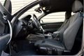 BMW 1-serie - 114i Sport RIJKLAAR PRIJS-GARANTIE Navigatie Xenon Sport Interieur - 1 - Thumbnail