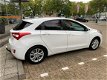 Hyundai i30 - 1.4i i-Motion Navi/Cam/16inch/Afn.Trekhaak - 1 - Thumbnail