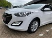 Hyundai i30 - 1.4i i-Motion Navi/Cam/16inch/Afn.Trekhaak - 1 - Thumbnail