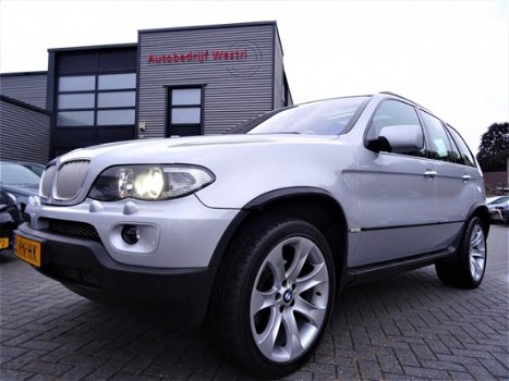 BMW X5 - 4.4i High Executive | 20 inch | Xenon | Navigatie | Panorama | Comfort stoelen | AUT | Led - 1