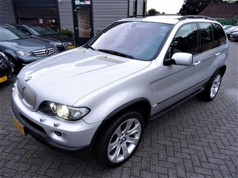 BMW X5 - 4.4i High Executive | 20 inch | Xenon | Navigatie | Panorama | Comfort stoelen | AUT | Led - 1