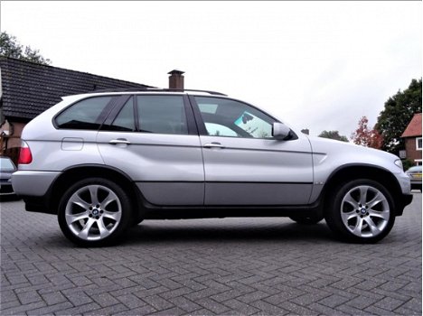 BMW X5 - 4.4i High Executive | 20 inch | Xenon | Navigatie | Panorama | Comfort stoelen | AUT | Led - 1