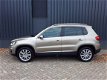 Volkswagen Tiguan - 1.4TSi 161pk Autom Highline Plus RIJKLAAR 100% onderhouden xenon+led, beige lede - 1 - Thumbnail