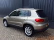 Volkswagen Tiguan - 1.4TSi 161pk Autom Highline Plus RIJKLAAR 100% onderhouden xenon+led, beige lede - 1 - Thumbnail