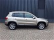 Volkswagen Tiguan - 1.4TSi 161pk Autom Highline Plus RIJKLAAR 100% onderhouden xenon+led, beige lede - 1 - Thumbnail