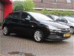 Opel Astra - Online Edition 105pk | AIRCO | NAVIGATIE + MEDIA | PARKEERSENSOREN + CAMERA | BOVAG GAR - 1 - Thumbnail