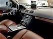 Volvo XC90 - 2.4 D5 R DESIGN AUT6 SUMMUM 185PK 7PERS LEDER SCHUIFDAK LMV PDC TREKHAAK - 1 - Thumbnail