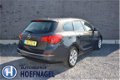 Opel Astra Sports Tourer - 1.6 Turbo Design Edition Airco, cruise, PDC achter, LM 16'' - 1 - Thumbnail