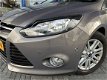 Ford Focus - 1.0 EcoBoost Titanium | Wegklapbare trekhaak | Climate Control | Voorruitverwarming | P - 1 - Thumbnail