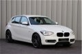 BMW 1-serie - 116i Aut8 Sport 5 Drs Clima Navi Pdc Stoelverw. Led-Xenon 2014 - 1 - Thumbnail