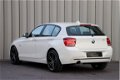 BMW 1-serie - 116i Aut8 Sport 5 Drs Clima Navi Pdc Stoelverw. Led-Xenon 2014 - 1 - Thumbnail