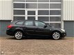Opel Astra Sports Tourer - 1.4 Turbo Navigatie/PDC/Half leder - 1 - Thumbnail