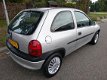 Opel Corsa - 1.2i-16V Strada APK 10-2020, stuurbekr. Inruil mogelijk - 1 - Thumbnail