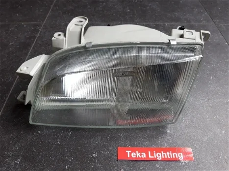 Toyota Carina E T19 (95-97) Koplamp Bosch 0318097313 Links NOS - 0