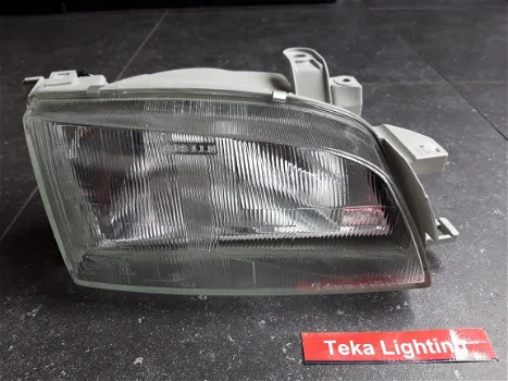 Toyota Carina E T19 (95-97) Koplamp Bosch 0318097114 Rechts NOS - 0