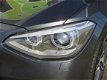BMW 1-serie - 118d High Executive Automaat Leder Sportstoel Xenon Gr Navi Clima PDC Stoelverw - 1 - Thumbnail