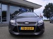 Ford Focus Wagon - Titanium-125pk-18-inch vol optiesdriv.ass.pack-half stof/leder navi-winterpakket- - 1 - Thumbnail