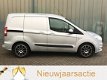 Ford Transit Courier - 1.6 TDCI 96 PK CLIMA, STOELVERWARMING, PDC - 1 - Thumbnail