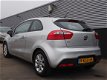 Kia Rio - 1.2 CVVT Comfort Pack Trekhaak, Navi, Lm velgen - 1 - Thumbnail