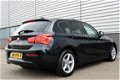 BMW 1-serie - 118i EDE Corporate Lease Essential RIJKLAAR PRIJS-GARANTIE Schuifdak Navigatie Sport I - 1 - Thumbnail