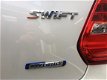 Suzuki Swift - 1.0 TURBO 112 PK STYLE SMART HYBRID NW MODEL NAVI 2250 KM - 1 - Thumbnail
