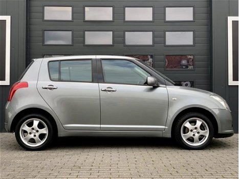 Suzuki Swift - 1.3 AIRCO - 5DRS - NAVIGATIE - KEYLESS GO - LMV - 1