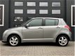 Suzuki Swift - 1.3 AIRCO - 5DRS - NAVIGATIE - KEYLESS GO - LMV - 1 - Thumbnail