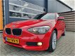 BMW 1-serie - 116i Business 5-deurs met Cruise control, Airco en Navigatie - 1 - Thumbnail