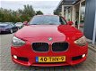 BMW 1-serie - 116i Business 5-deurs met Cruise control, Airco en Navigatie - 1 - Thumbnail