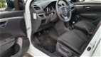 Suzuki Swift - 1.2 Comfort EASSS 5 Deurs Airco parelmoer wit 5 deurs airco lm velgen - 1 - Thumbnail