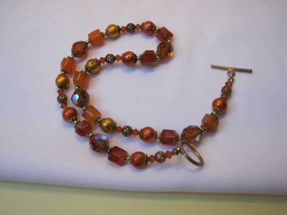 Armband goudkleurig oranje/rood aurora glas kralen 19.5 cm. - Afbeelding 5