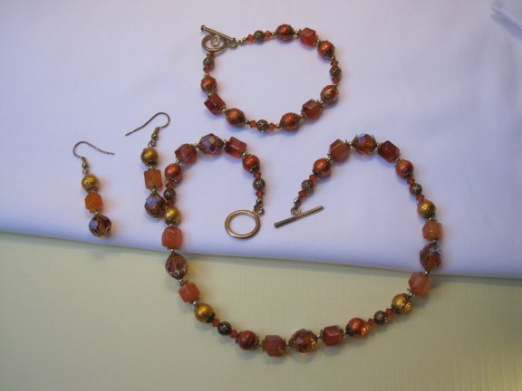 Armband goudkleurig oranje/rood aurora glas kralen 19.5 cm. - Afbeelding 7