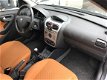 Opel Corsa - 1.4 16V Njoy El. ramen Radio/cd Schuifk.dak Parrot 113.576km - 1 - Thumbnail